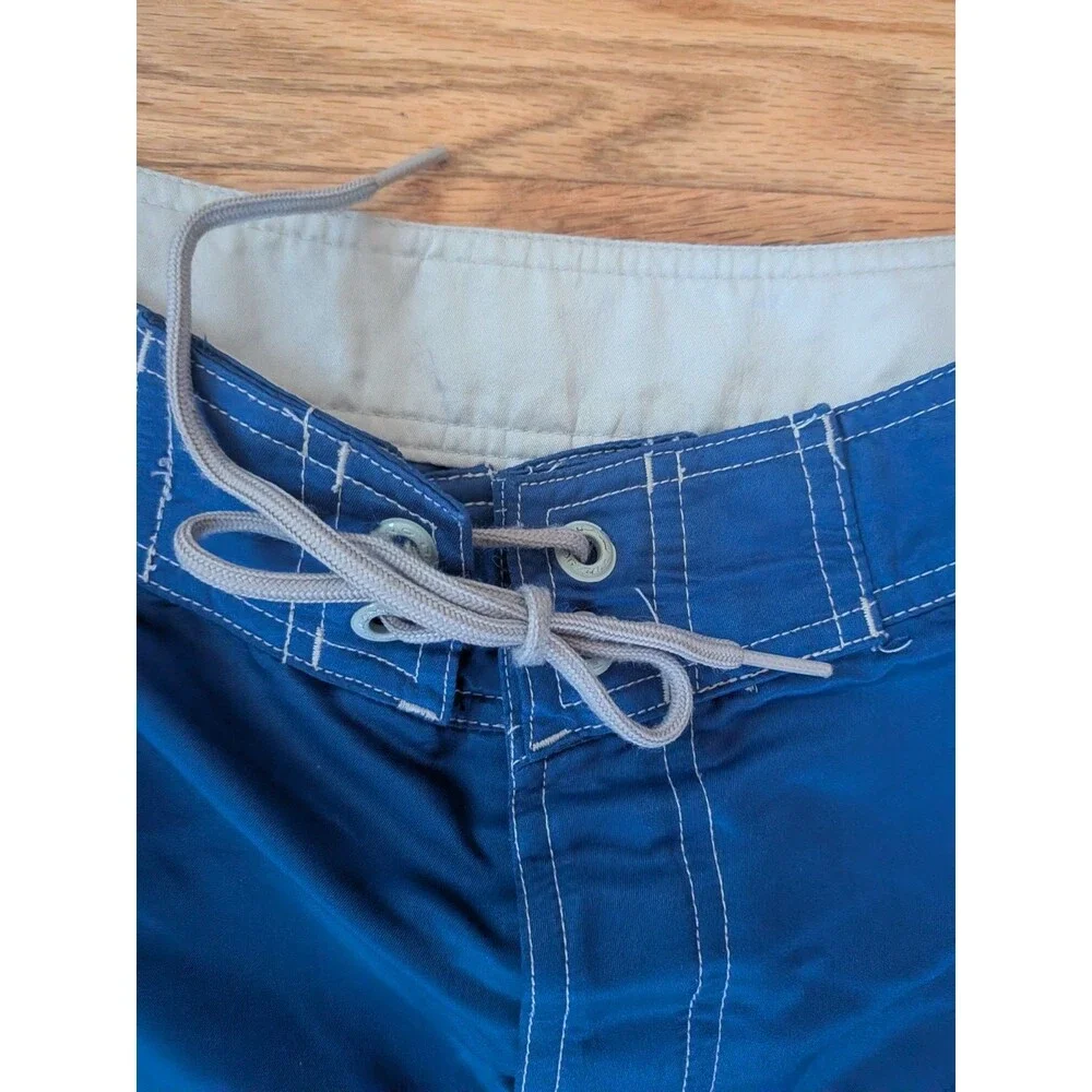 Vintage O'Neill Boardshorts Blue White Cargo Pockets Shiny Surf Wax Comb Size 34